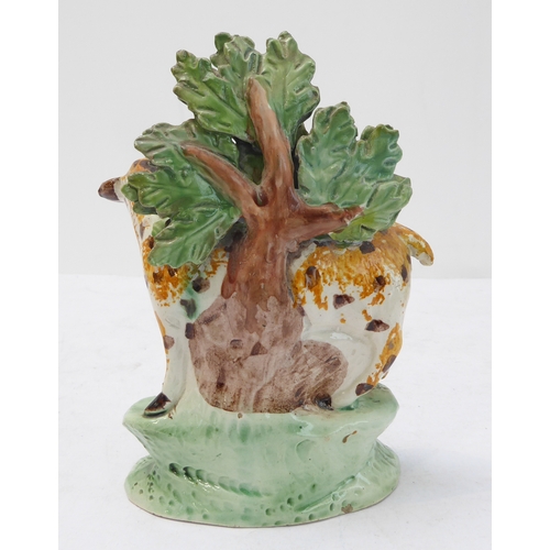 61 - An early 19th century spongeware-style bocage model of a spotted ewe and lamb (14.5 cm high)