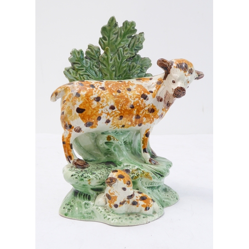 61 - An early 19th century spongeware-style bocage model of a spotted ewe and lamb (14.5 cm high)