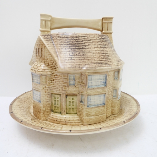 64 - A hand-decorated 'Bell Inn - 1642' ceramic Stilton plate and cover. The plate with text reading 'In ... 