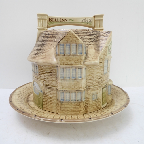 64 - A hand-decorated 'Bell Inn - 1642' ceramic Stilton plate and cover. The plate with text reading 'In ... 