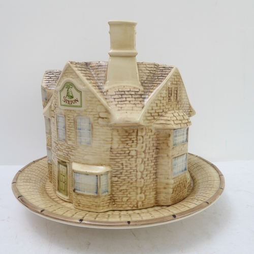 64 - A hand-decorated 'Bell Inn - 1642' ceramic Stilton plate and cover. The plate with text reading 'In ... 