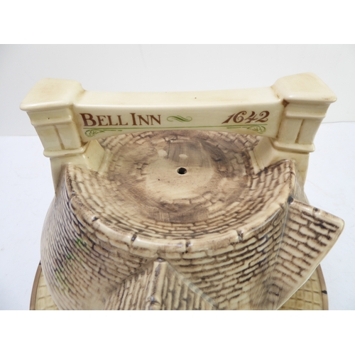 64 - A hand-decorated 'Bell Inn - 1642' ceramic Stilton plate and cover. The plate with text reading 'In ... 