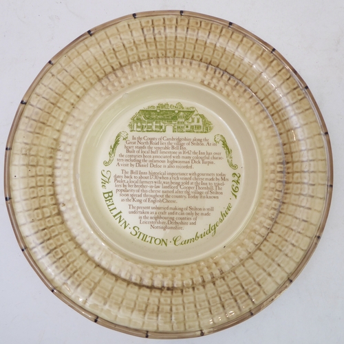 64 - A hand-decorated 'Bell Inn - 1642' ceramic Stilton plate and cover. The plate with text reading 'In ... 