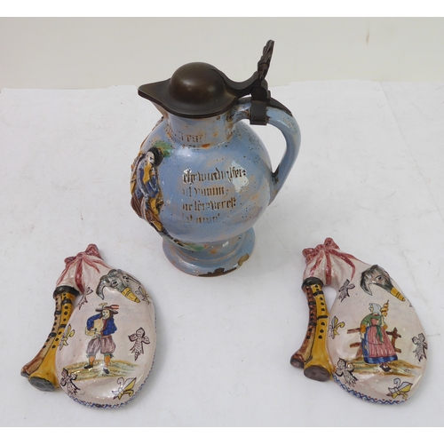 70 - A pair of Porquier-Beau Quimper faience wall-pockets and a glazed German stoneware flagon:
 1. The w... 