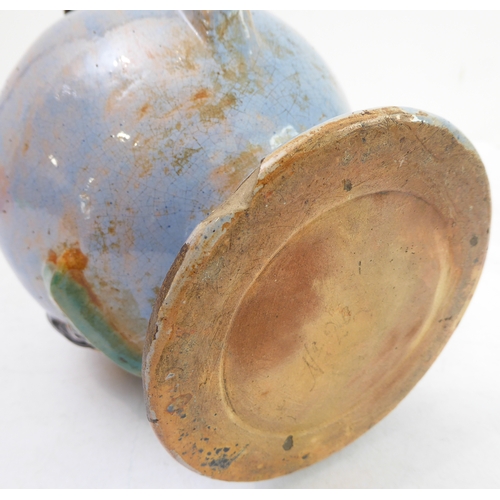 70 - A pair of Porquier-Beau Quimper faience wall-pockets and a glazed German stoneware flagon:
 1. The w... 