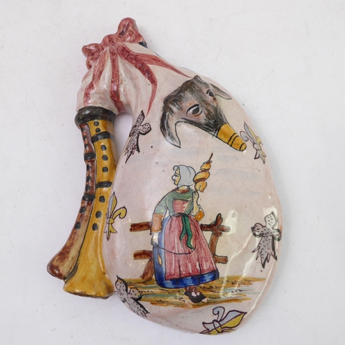 70 - A pair of Porquier-Beau Quimper faience wall-pockets and a glazed German stoneware flagon:
 1. The w... 