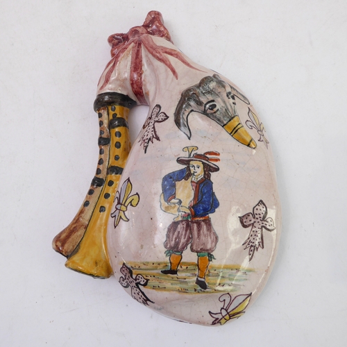 70 - A pair of Porquier-Beau Quimper faience wall-pockets and a glazed German stoneware flagon:
 1. The w... 