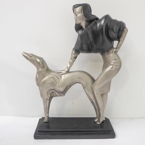 74 - Two Austin Production Inc. ceramic sculptural female figures:
 An Art Deco lady with Borzoi dog on r... 
