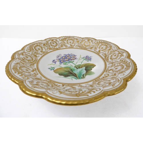 81 - A 19th century ceramic dessert comport: ornately scrolling gilded border surrounding a central vigne... 