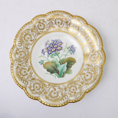 81 - A 19th century ceramic dessert comport: ornately scrolling gilded border surrounding a central vigne... 