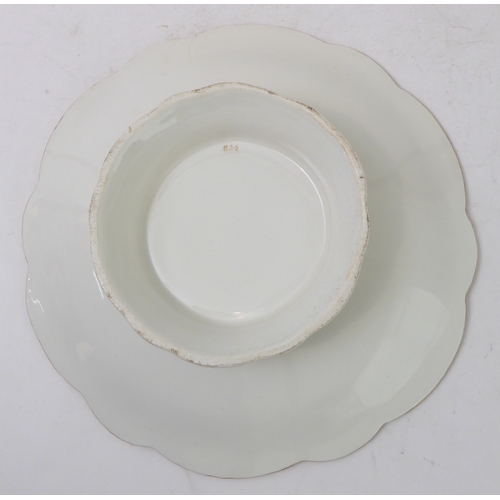 81 - A 19th century ceramic dessert comport: ornately scrolling gilded border surrounding a central vigne... 