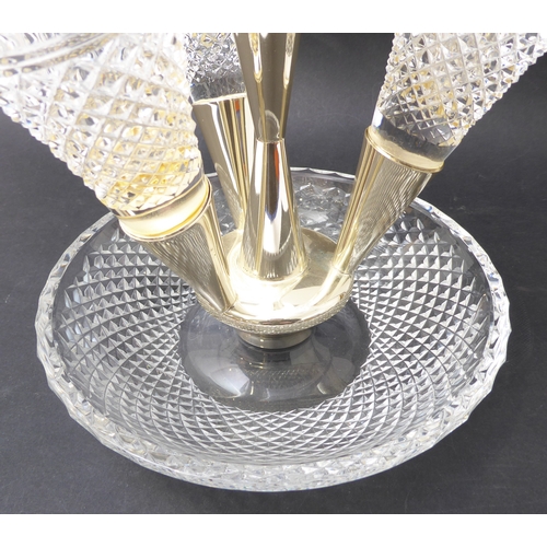 98 - A 20th century lead crystal four-branch epergne. The four hobnail and floral wheel cut glass branche... 