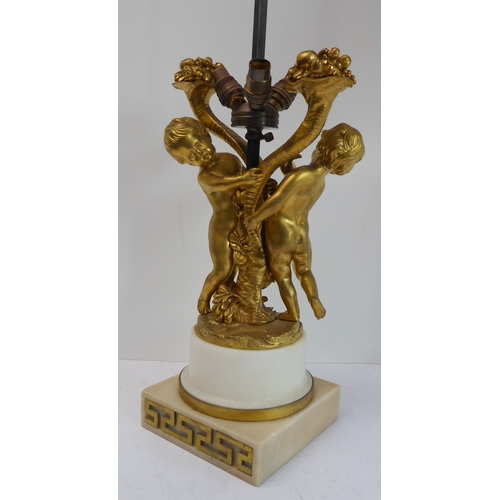 114 - A pair of fine 19th century ormolu table lamps: each modelled as two cherubic-style figures with cor... 