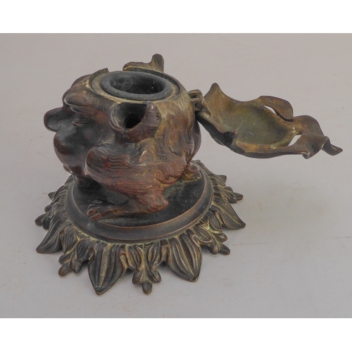 120 - A late 19th century bronze therianthrope inkwell in the form of a biped with human head and canine l... 