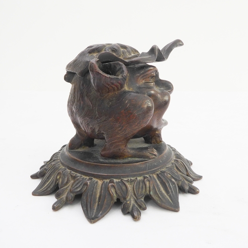 120 - A late 19th century bronze therianthrope inkwell in the form of a biped with human head and canine l... 