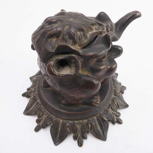 120 - A late 19th century bronze therianthrope inkwell in the form of a biped with human head and canine l... 