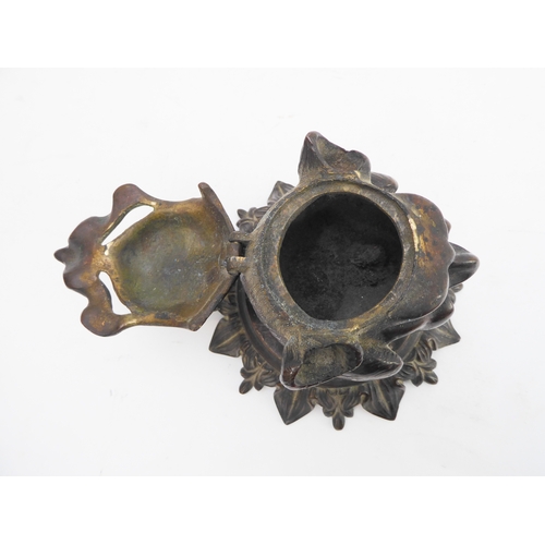 120 - A late 19th century bronze therianthrope inkwell in the form of a biped with human head and canine l... 