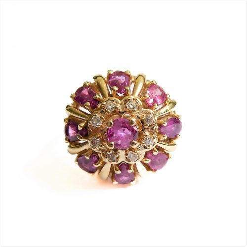 281 - A 14-carat gold bombé ring set with rubies and diamonds , ring size Q