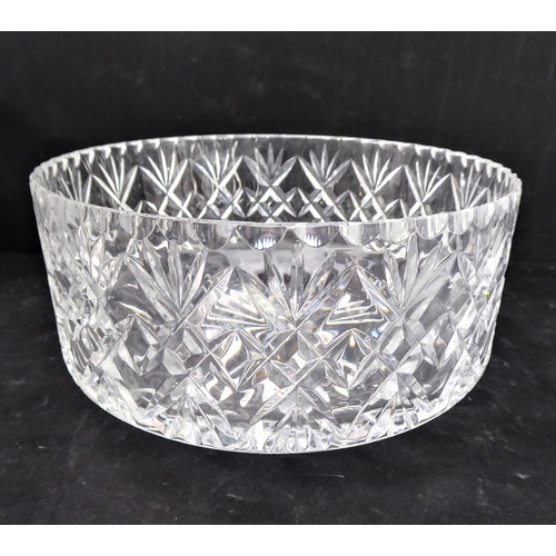102 - Five pieces of cut glassware:
 three bowls (one with 'nibbles' to rim);
 a tall and elegant hand-cut... 