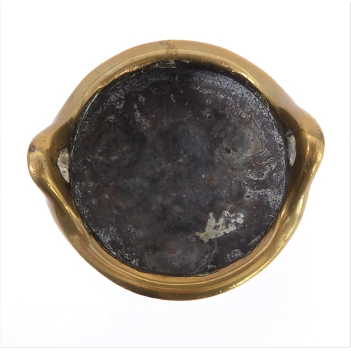 111 - A Chinese polished brass/bronze two-handled tripod censer in 17th century style: reign marks within ... 