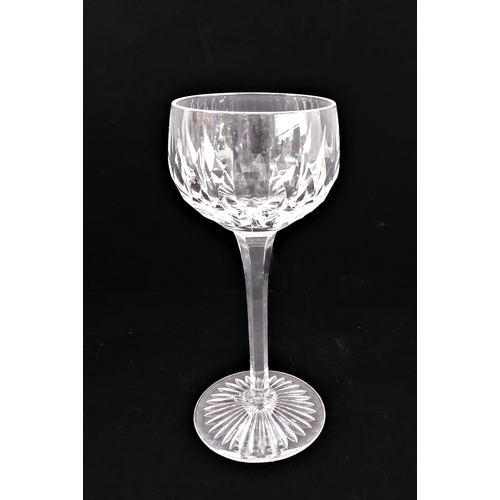99 - A set of eight hand-cut hock glasses with star-cut bases, together with a set of four hand-cut flute... 
