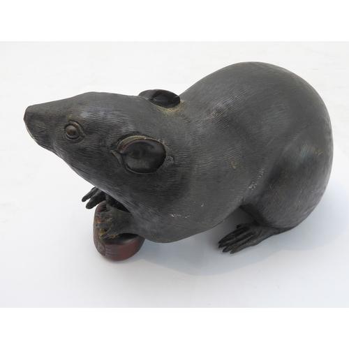 119 - In the style of Muroe Kichibei, a Japanese Meiji period patinated bronze realistic sculpture of a ra... 