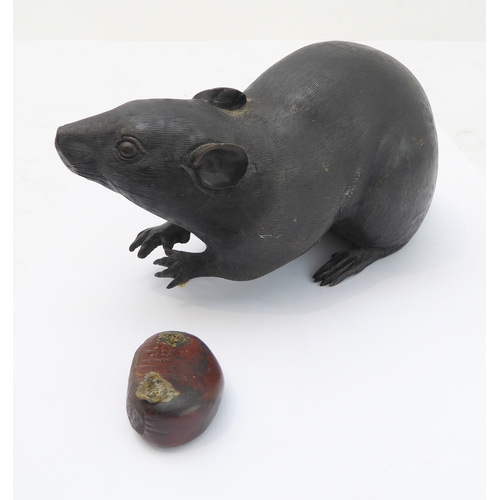 119 - In the style of Muroe Kichibei, a Japanese Meiji period patinated bronze realistic sculpture of a ra... 