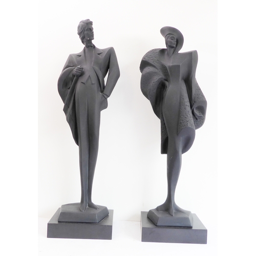 80 - A pair of Austin Productions Inc. black ceramic figures of a lady and gentleman, signed 