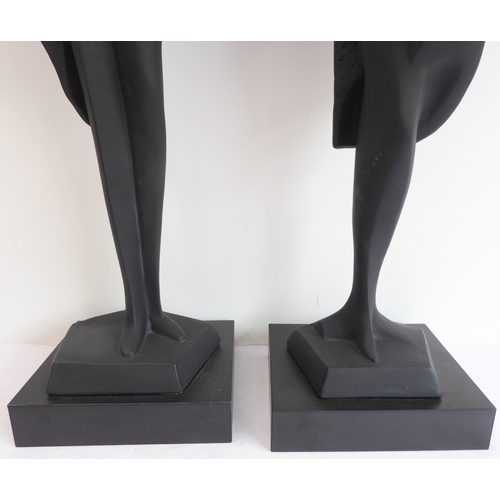 80 - A pair of Austin Productions Inc. black ceramic figures of a lady and gentleman, signed 