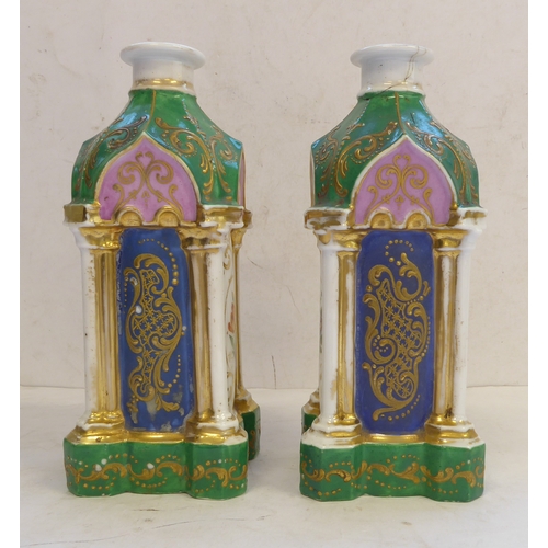 48 - A pair of 19th century Coalport pagoda shaped green enamel and gilt decorated candlesticks. The face... 