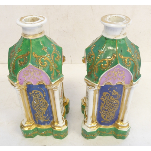 48 - A pair of 19th century Coalport pagoda shaped green enamel and gilt decorated candlesticks. The face... 