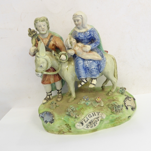 53 - A pair of early 19th century Walton Staffordshire lead glazed earthenware religious figures, 