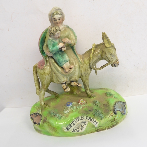 53 - A pair of early 19th century Walton Staffordshire lead glazed earthenware religious figures, 