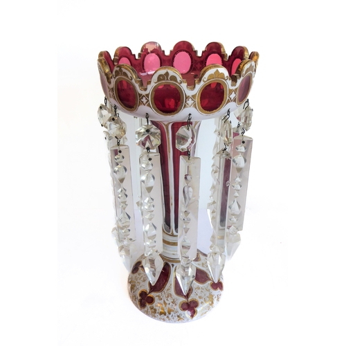 78 - Two large and similar 19th century cranberry table lustres: cameo cut; long glass droplets; circular... 