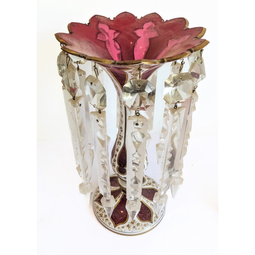 78 - Two large and similar 19th century cranberry table lustres: cameo cut; long glass droplets; circular... 