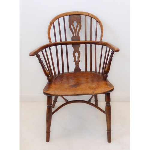 409 - A mid-19th century fruitwood Windsor chair: pierced splat and spindle back above a shaped bow and sh... 