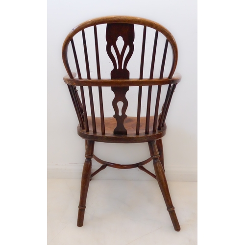 409 - A mid-19th century fruitwood Windsor chair: pierced splat and spindle back above a shaped bow and sh... 