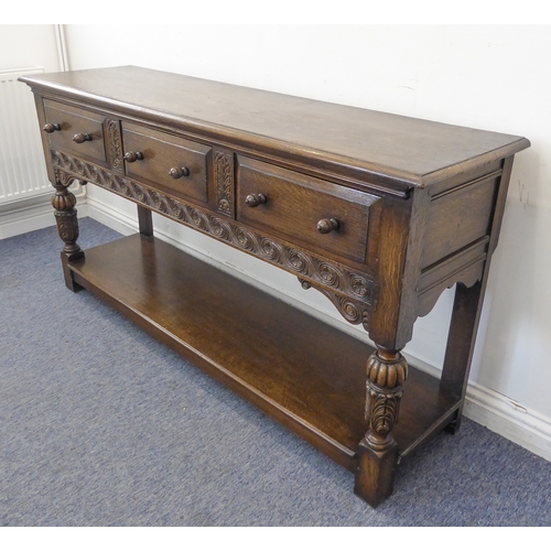 510 - (matches 21598-2) The matching reproduction oak dresser base of very fine quality: the moulded top e... 