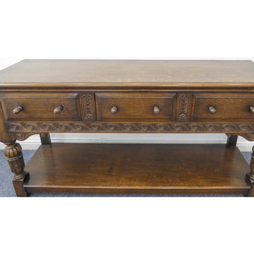 510 - (matches 21598-2) The matching reproduction oak dresser base of very fine quality: the moulded top e... 
