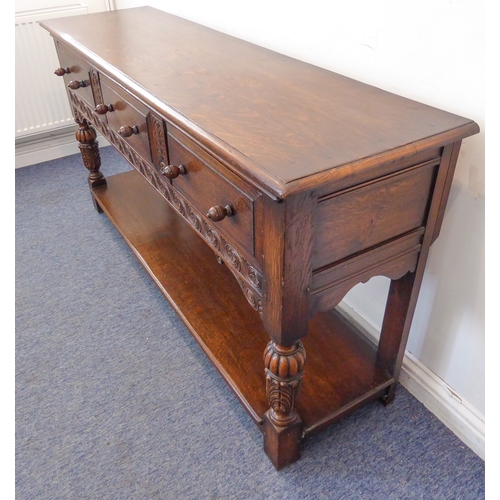 510 - (matches 21598-2) The matching reproduction oak dresser base of very fine quality: the moulded top e... 