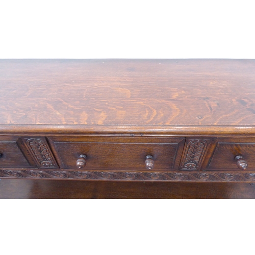 510 - (matches 21598-2) The matching reproduction oak dresser base of very fine quality: the moulded top e... 