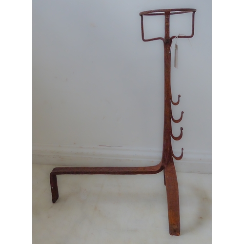 114 - Two oxidised cast and wrought iron fire dogs (46cm deep x 66.5cm high)