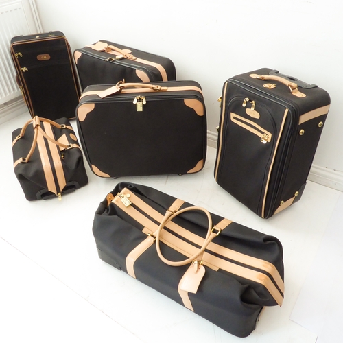 A five-piece set of Classique Noir luggage by the French Luggage Company of  the USA and a similar ro