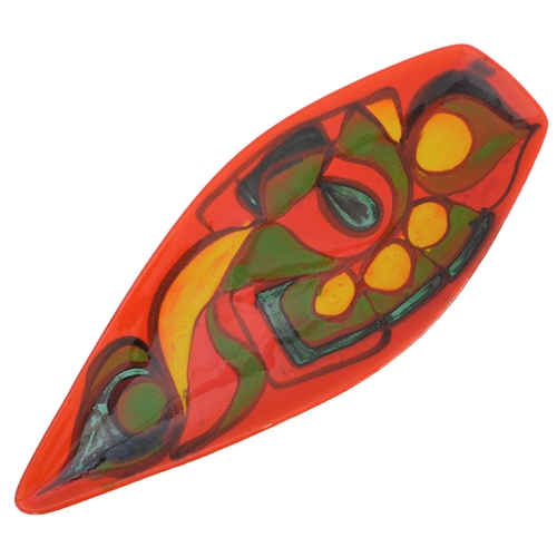 24 - Two pieces:
 1. a Poole Pottery 'Delphis' boat-shaped studioware dish with 'Poole - England - 82' pa... 