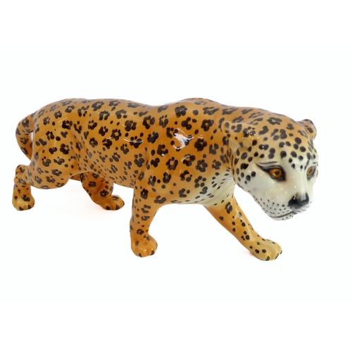 27 - A large Beswick model of a prowling leopard (29.75 cm).
 (Restoration to ear)