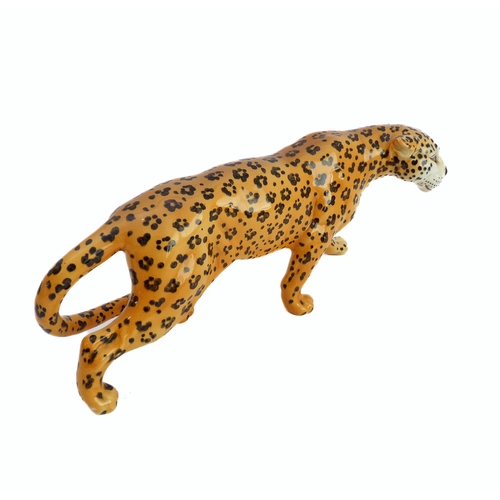27 - A large Beswick model of a prowling leopard (29.75 cm).
 (Restoration to ear)