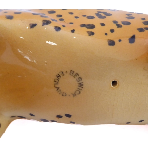 27 - A large Beswick model of a prowling leopard (29.75 cm).
 (Restoration to ear)