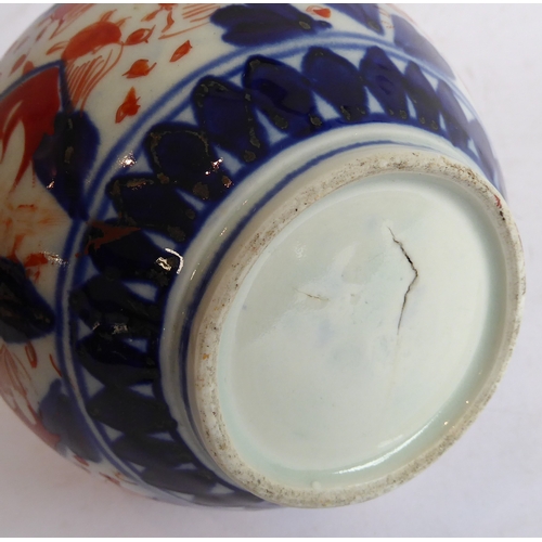 33 - A group of of six:
 1. a 19th century Japanese porcelain vase of waisted double-gourd form and hand-... 