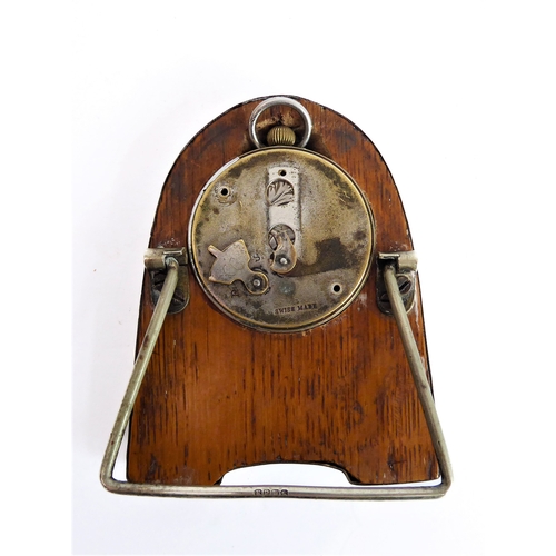 71 - A hallmarked silver easel watch holder, Birmingham 1914 containing a lady's silver-cased fob watch a... 