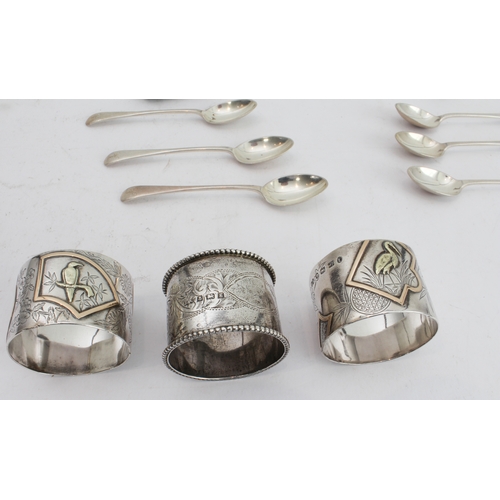 91 - Hallmarked silver comprising:
 an interesting pair of late 19th century napkin rings decorated in re... 
